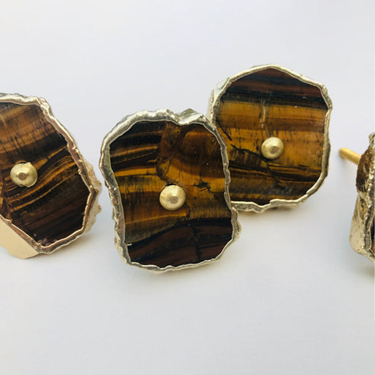 Close-up of tiger agate slice knobs striped brown and honey