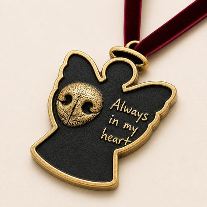 Close angled view of the angel ornament with the raised nose print and script lettering