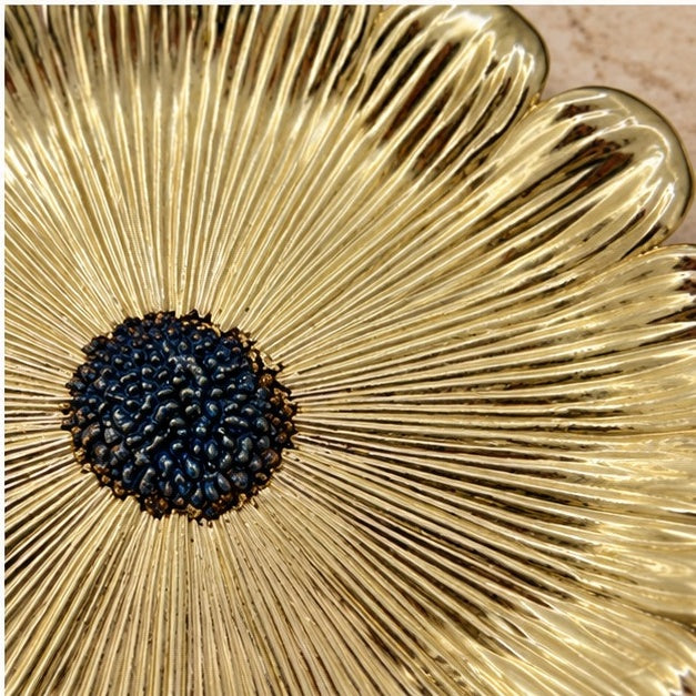 Close-up of the dark beaded center and the grooved gold petals