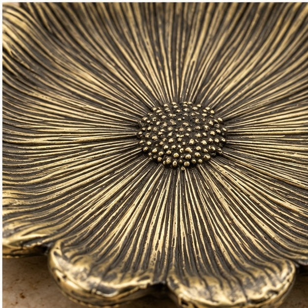 Close-up of the textured seed center in antique brass