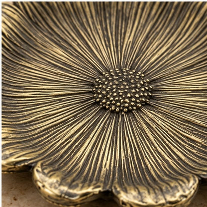 Close-up of the textured seed center in antique brass