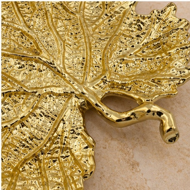 Close-up of the curled stem and veins in gold