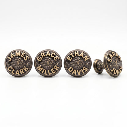 Four name knobs with different names, one turned to show its stem