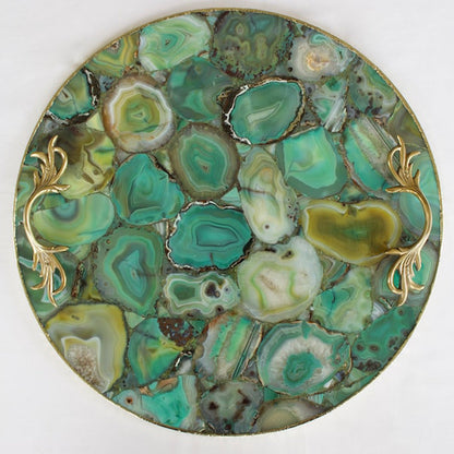 Rose gold finish over the brass handles of a green agate tray