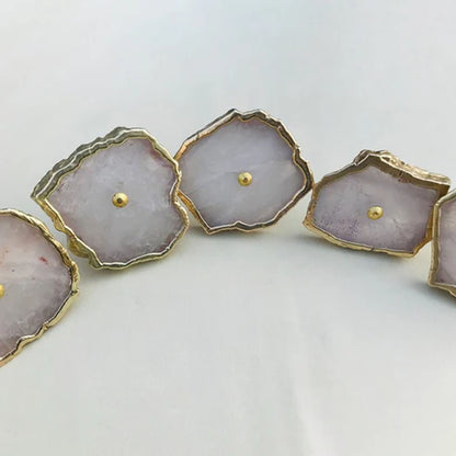 Pale pink rose quartz slice knobs with gold edges, in a curve
