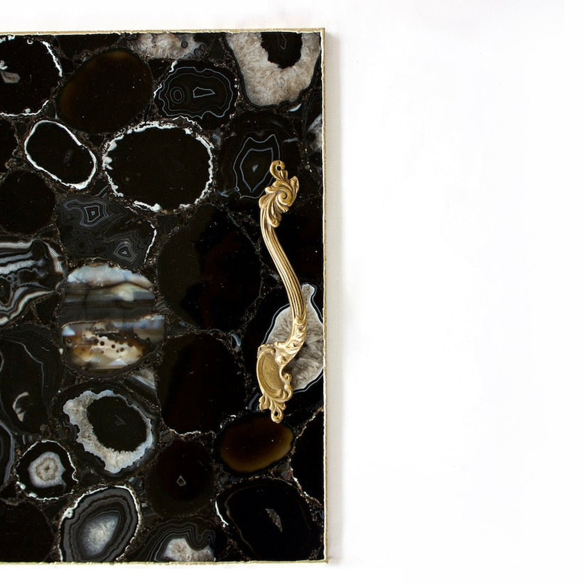 Black agate serving tray with a rose gold rim