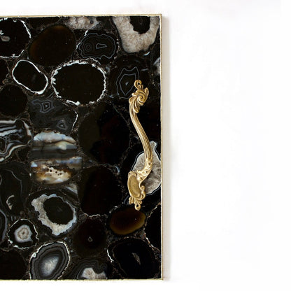 Black agate serving tray with a rose gold rim