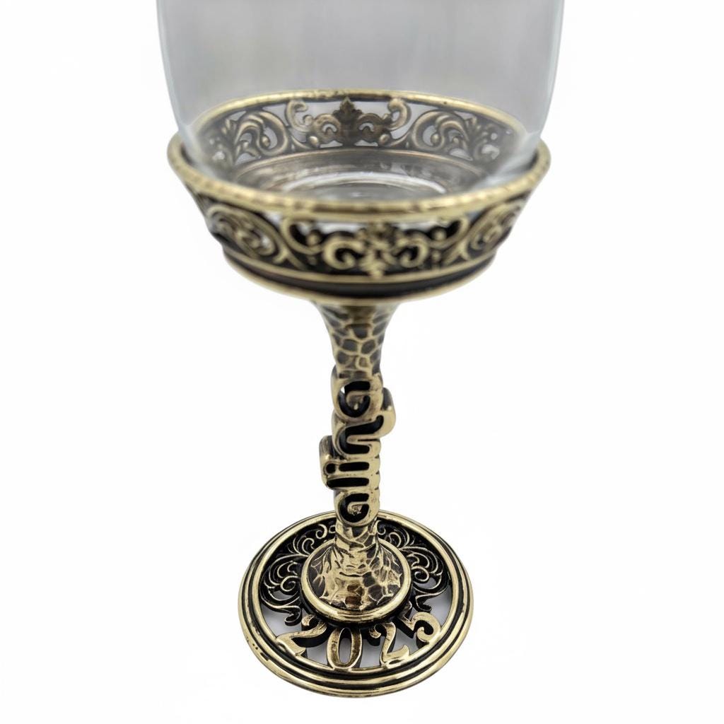 Antique brass finish stem lettering and ornate foot