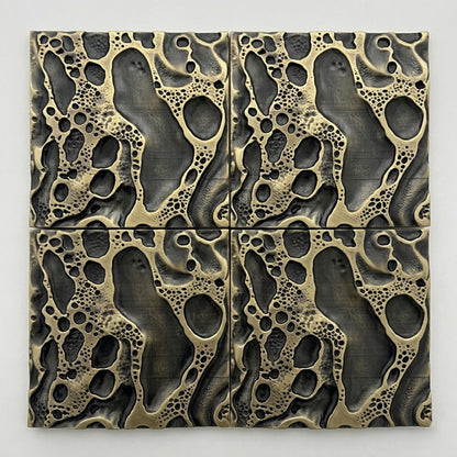 Four cosmic crater tiles in antique brass
