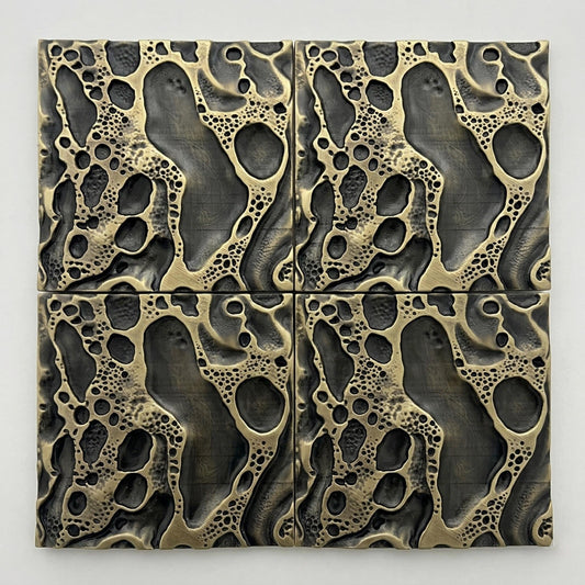 Four cosmic crater tiles in antique brass