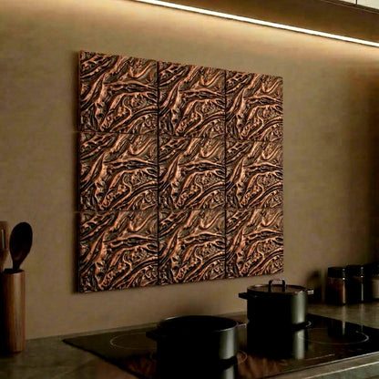 Molten lava tiles in antique copper on a lit kitchen wall