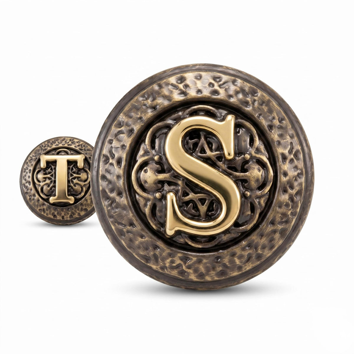 Close-up of an S initial knob with a T knob behind it