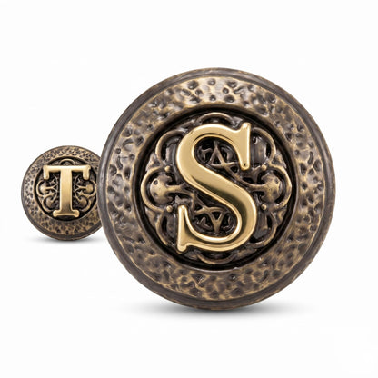 Close-up of an S initial knob with a T knob behind it