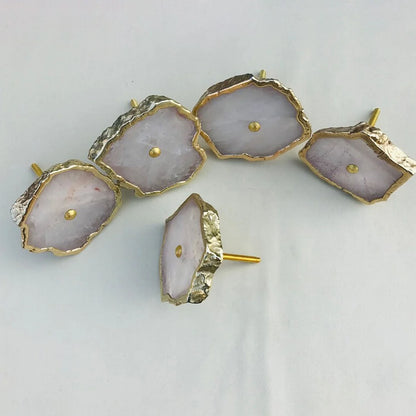 Rose quartz slice knobs, one turned to show its bolt
