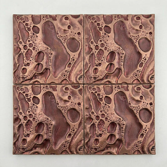 Four blush pink cosmic crater tiles set in a square