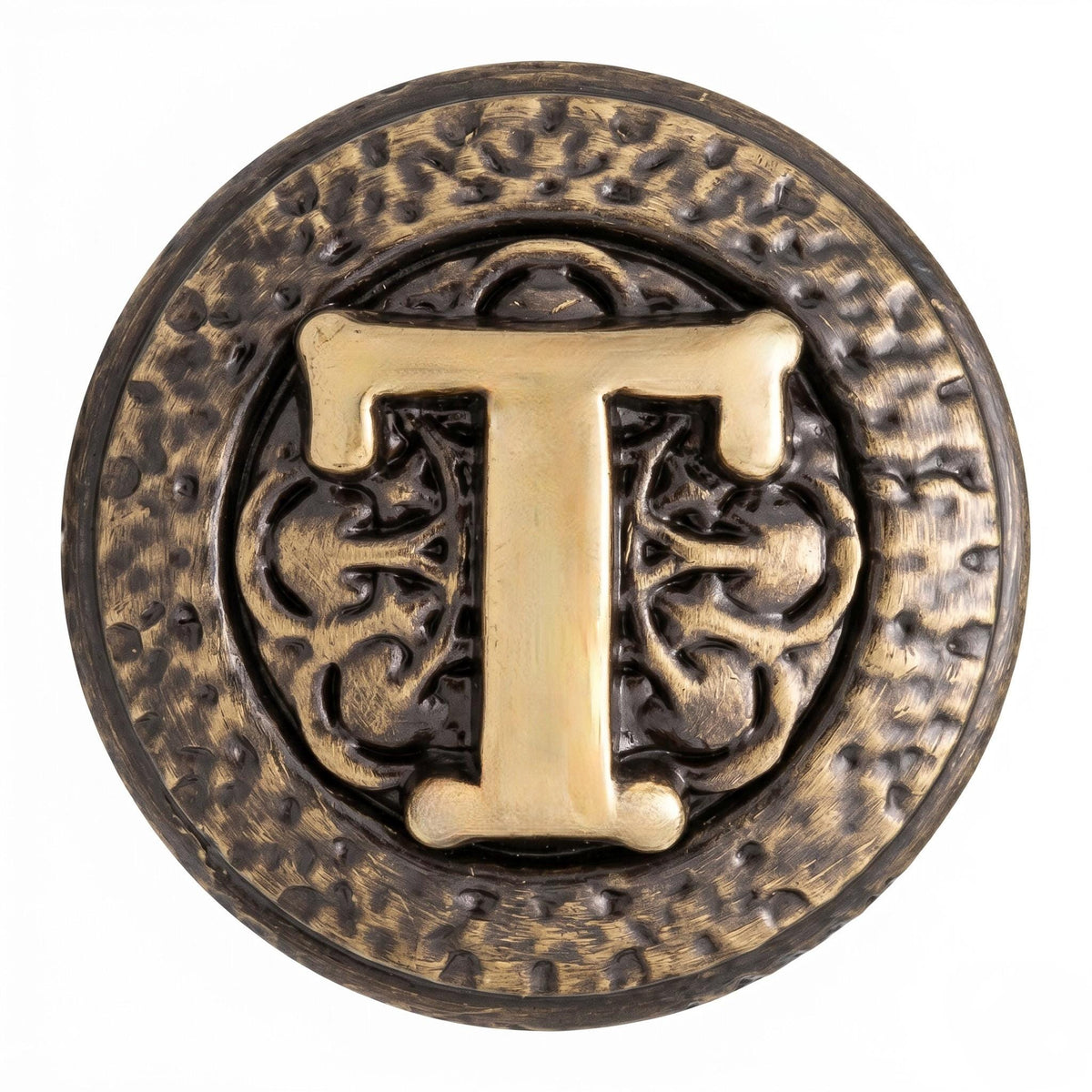 Close-up of a T knob, the letter on a scrolled ground