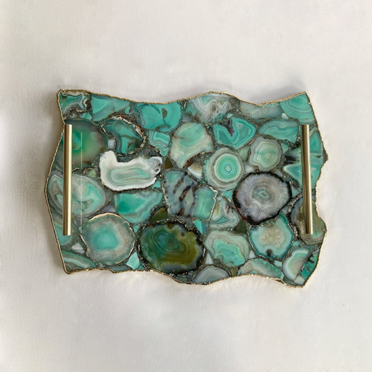 Solid brass handles on a green agate tray