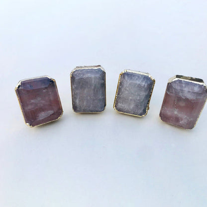 Four rectangular faceted clear quartz cabinet knobs in gilded collars