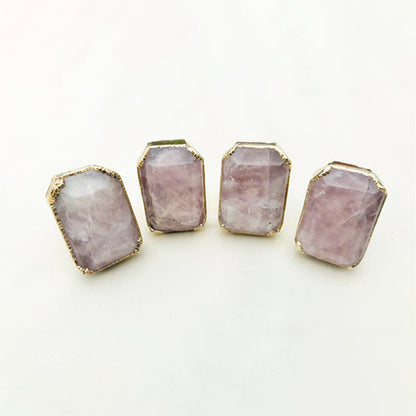 Four rectangular faceted rose quartz cabinet knobs in gilded collars