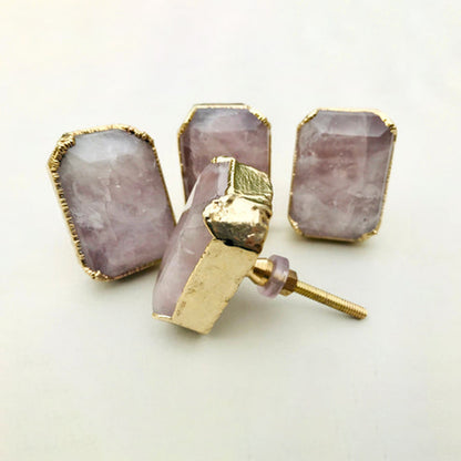 Emerald-cut rose quartz knobs, one turned to show its bolt