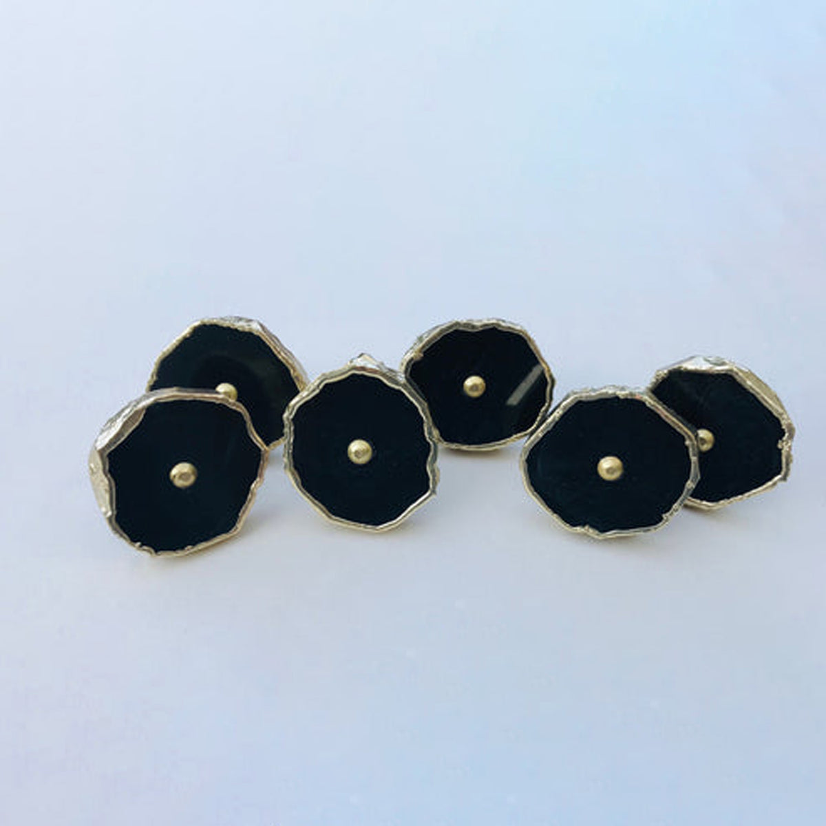 Five round black agate slice cabinet knobs with gilded rims