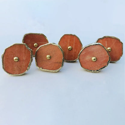 Four burnt orange agate slice cabinet knobs with gilded rims