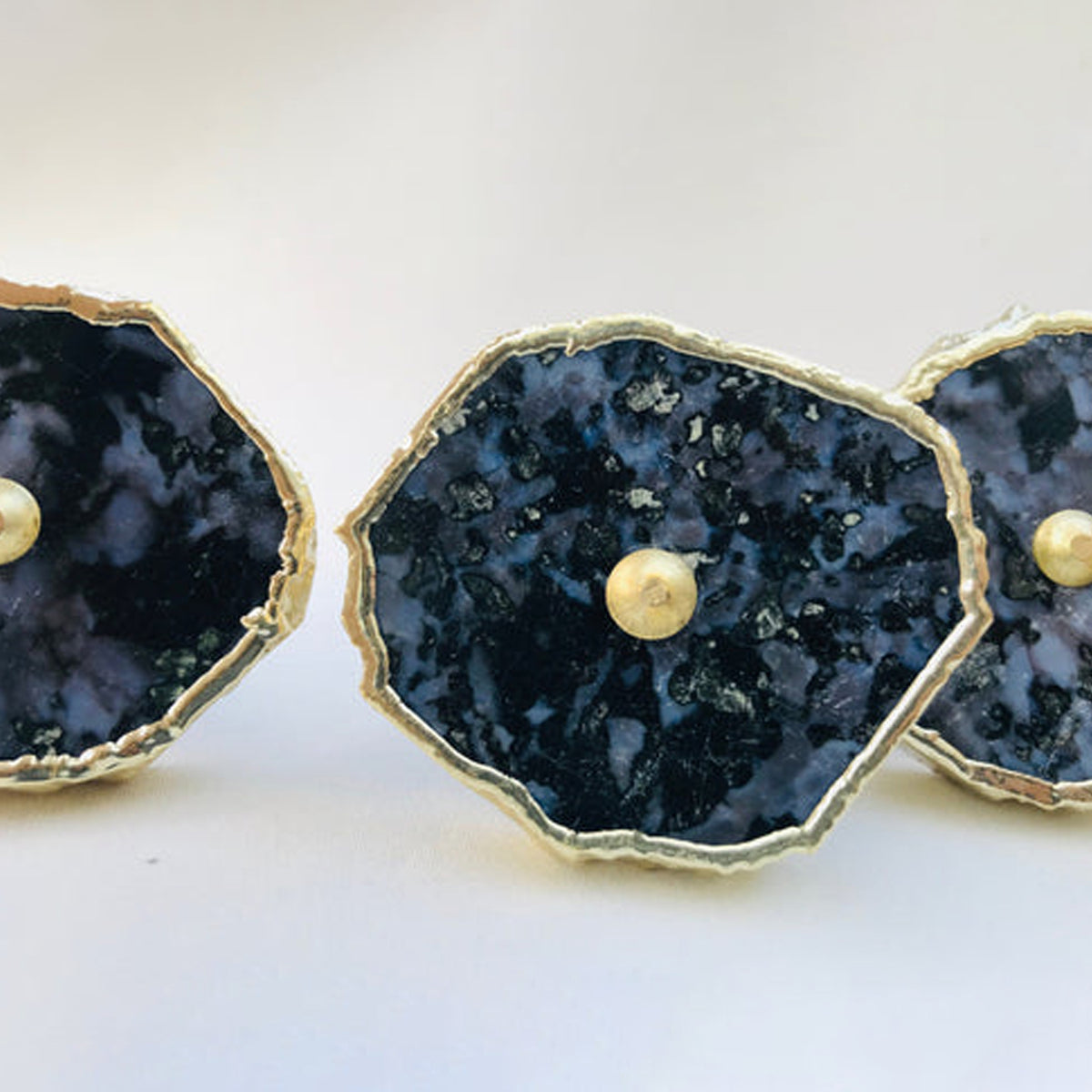 Gabbro slice knobs with gold edges and center pins