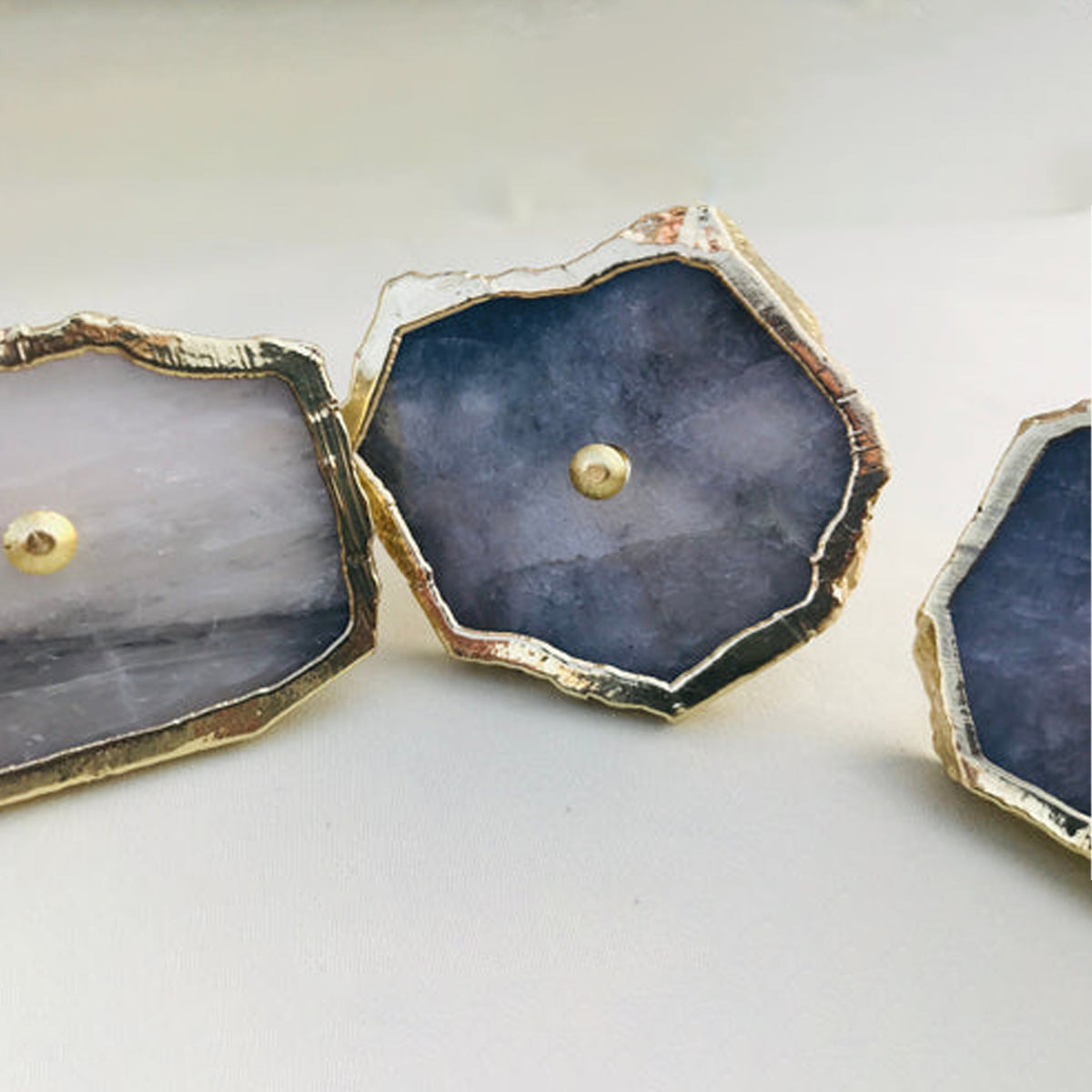 Row of gray agate quartz slice knobs, slate blue in the center