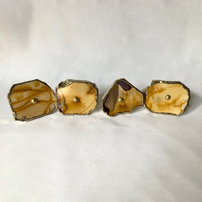 Four mookaite slice cabinet knobs in tan and cream with gilded rims