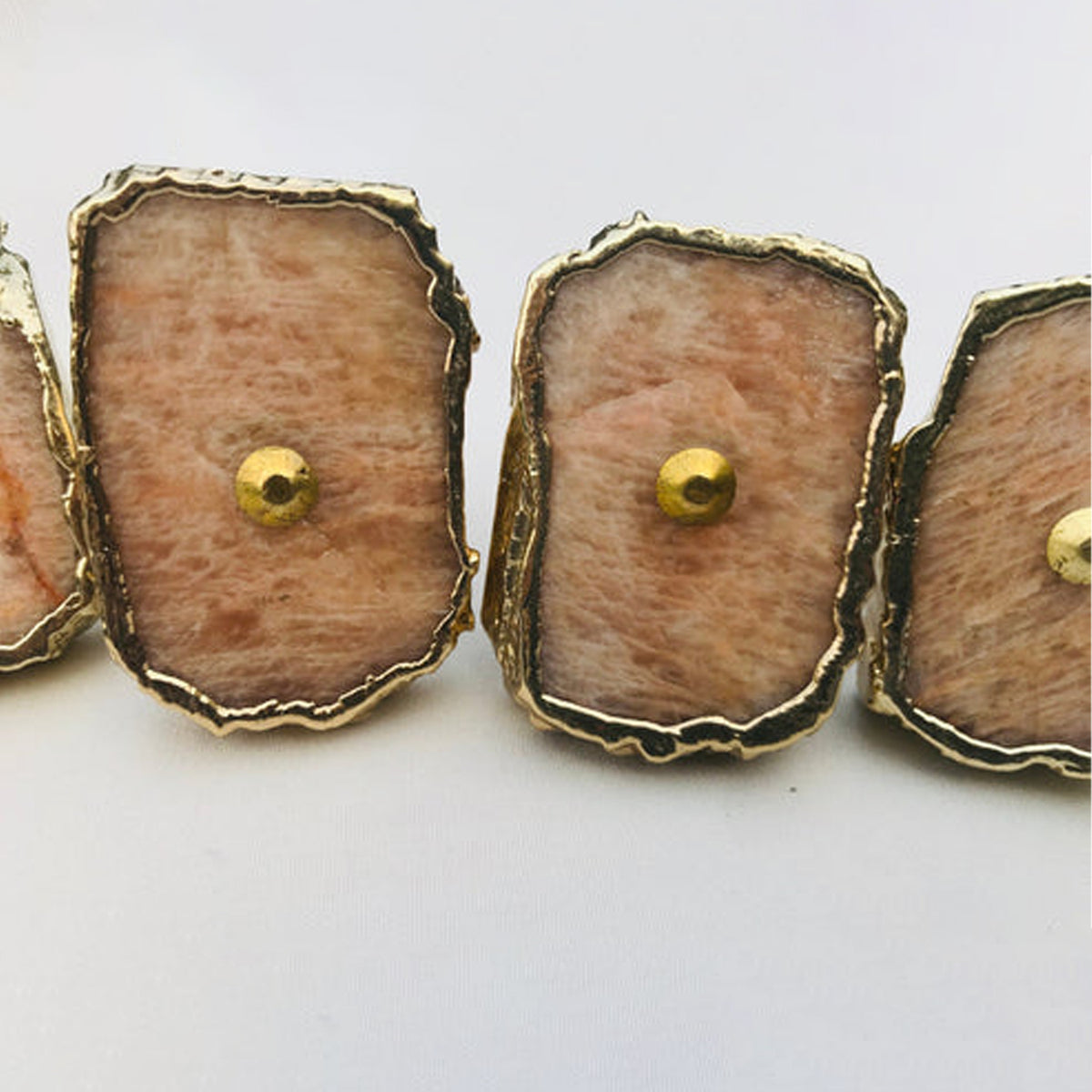 Close-up of peach moonstone slice knobs