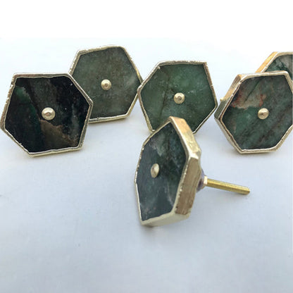 Five hexagonal sage green agate cabinet knobs with gold edges, one turned to show its bolt