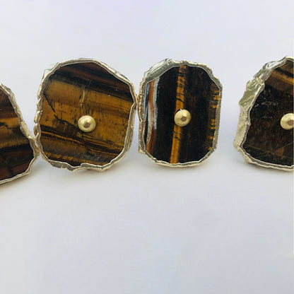 Closer view of tiger agate slice knobs striped in amber and brown