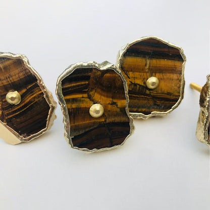 Close-up of tiger agate slice knobs striped brown and honey