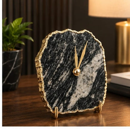 Zebra agate desk clock on a dark wooden desk with a lamp
