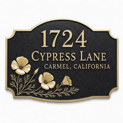 Arched antique brass plaque with a spray of poppies, reading 1724 Cypress Lane, Carmel, California