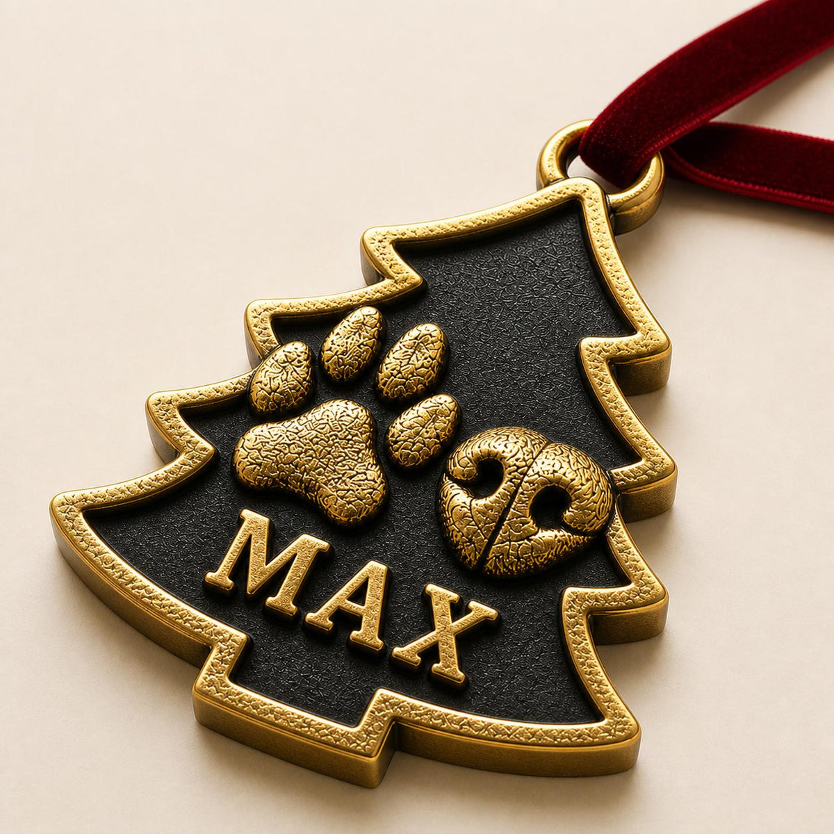 Close angled view of the tree-shaped ornament with the raised paw, nose and MAX