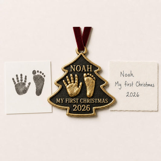An antique brass tree-shaped baby ornament with a raised handprint and footprint