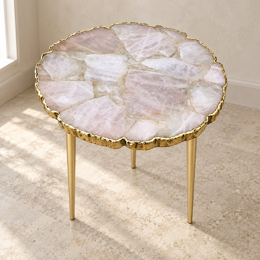 
Rose Quartz Side Table, Organic Edge with a gold rim and three plain gold legs, shown full length in a room