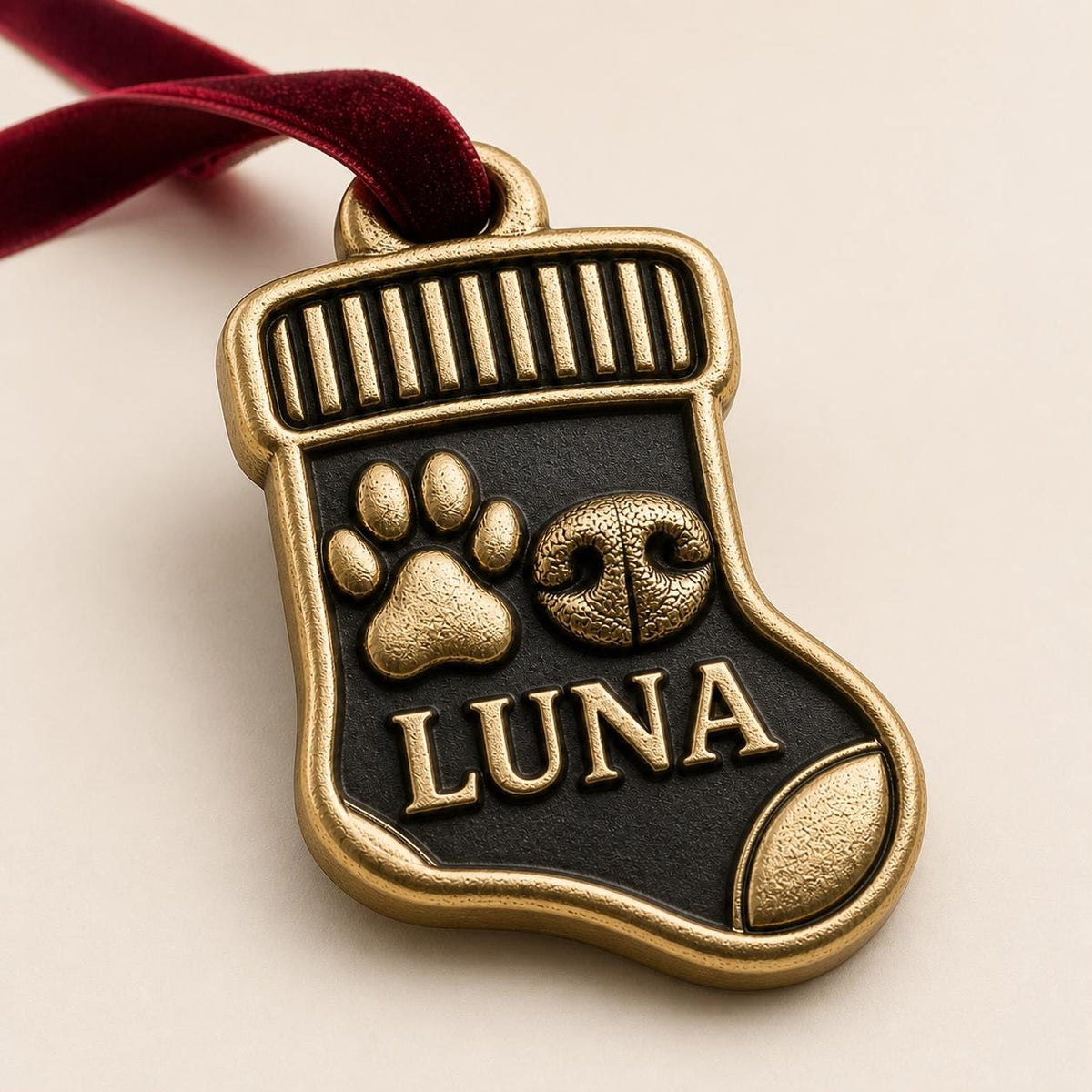 Close angled view of the stocking ornament with the raised paw, nose and LUNA