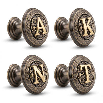 Four initial knobs reading A, K, N and T, angled to show their stems